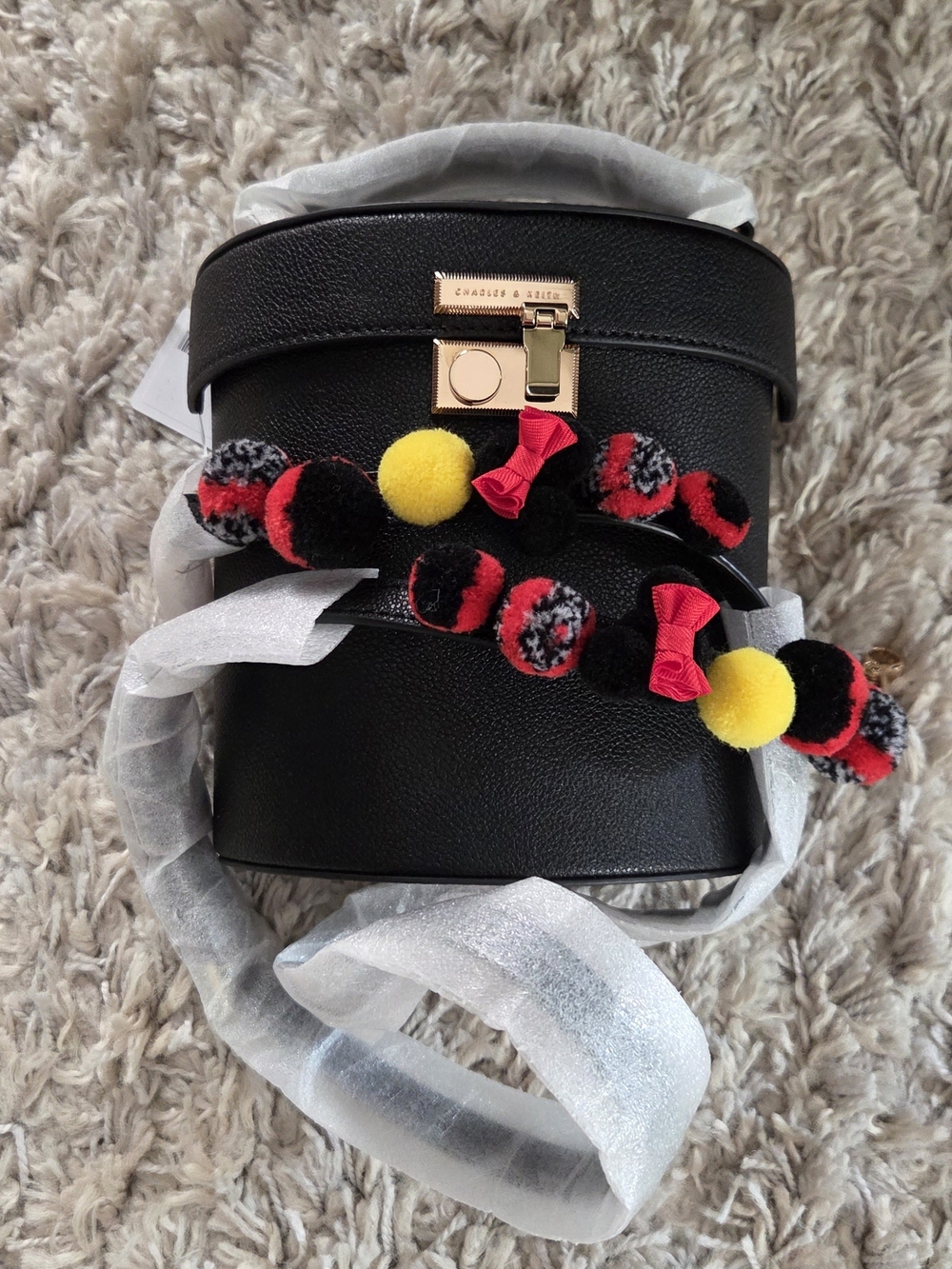 Charles & Keith x Disney Tsum Tsum Minnie Mouse Pom-Pom Cylinder Bag